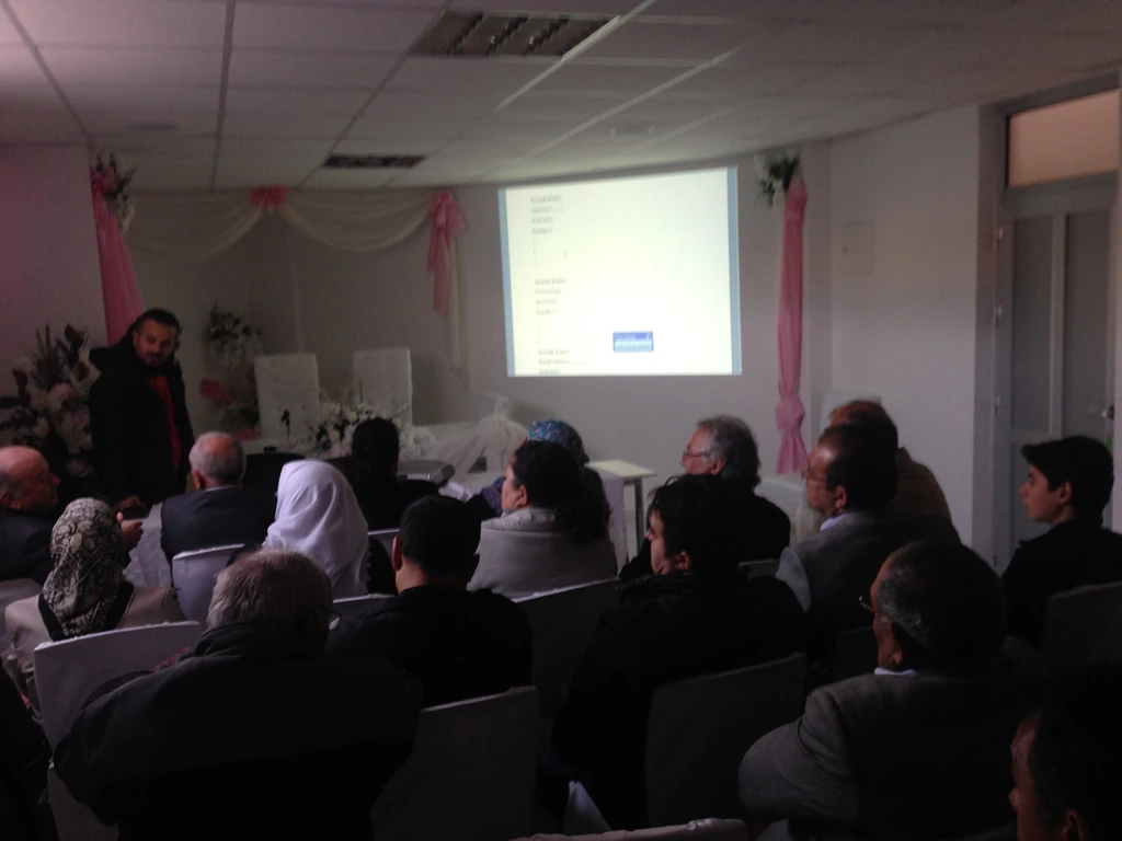 Workshop in the wedding hall, projector screen and participants