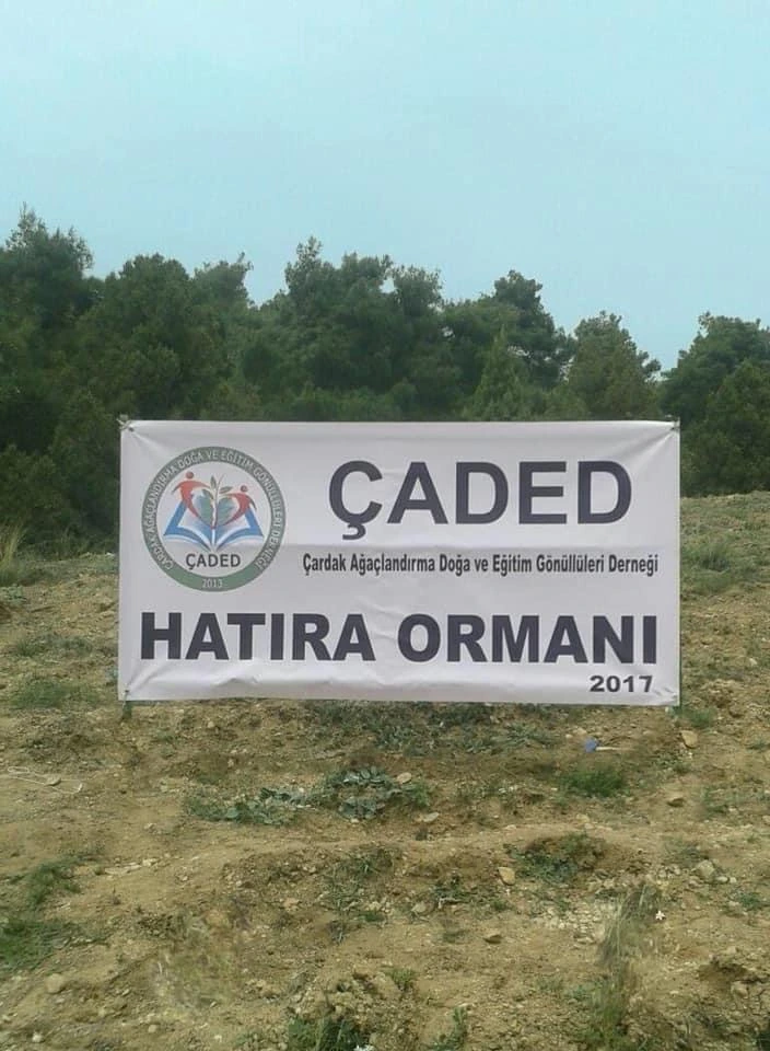 ÇADED Memorial Forest 2017 banner at the planting site